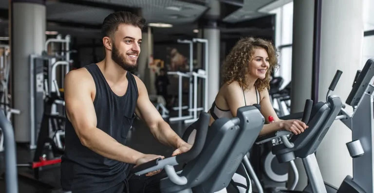 Residents training on exercise bikes in a fully equipped fitness centre