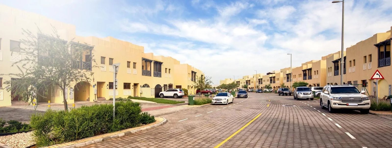 Hydra Village exterior view — off-plan villas in Rawdat Al-Reef