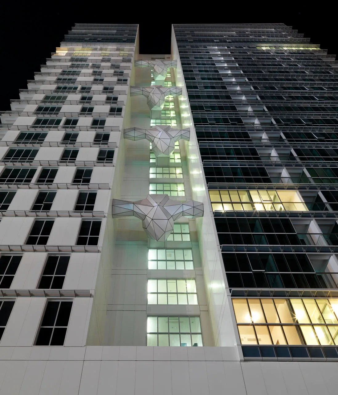 Rihan Heights exterior view — off-plan apartments in Zayed Sports City